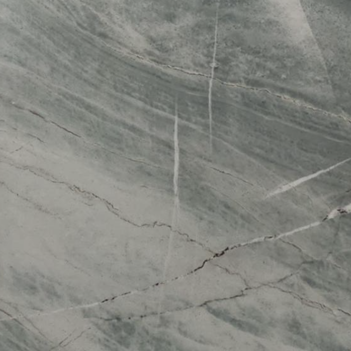 Close-up of a gray marble surface with veining